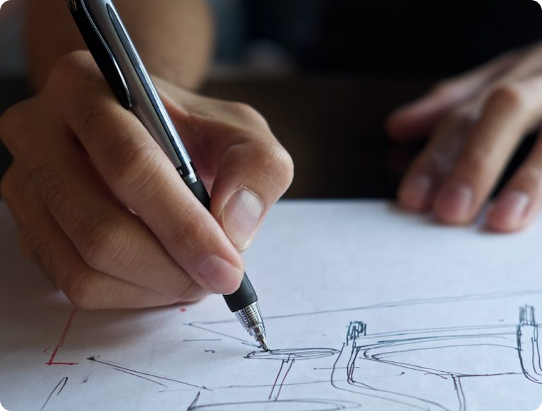 Hand sketching with pen on white paper