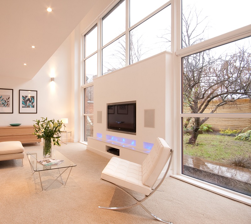 Modern office interior with light wood chairs and screens
