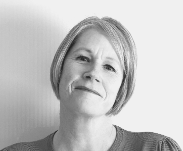 Black and white portrait photo of smiling woman