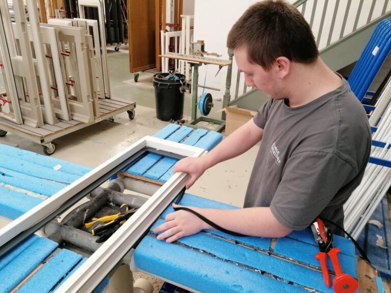 Man using router on timber frame
