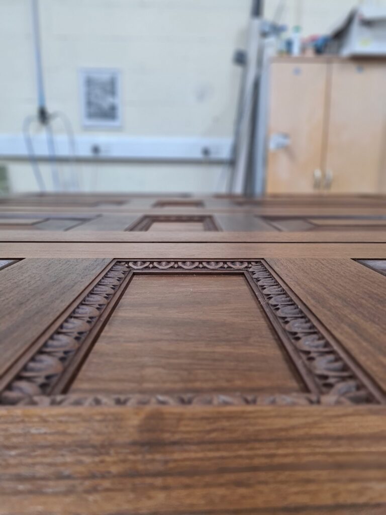 Ornate timber inlay detail on door panel