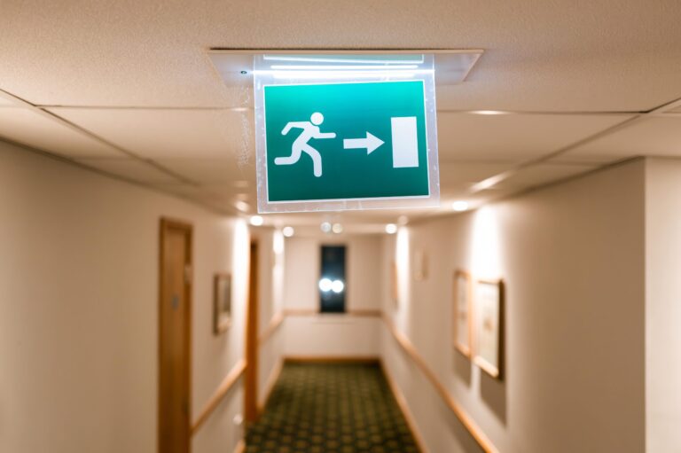 Emergency exit sign in hallway