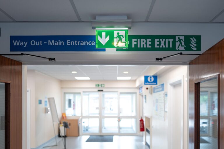 Hospital corridor with emergency exit sign