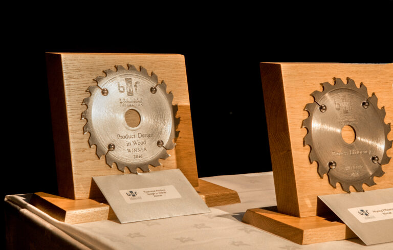 Wooden awards displayed on table