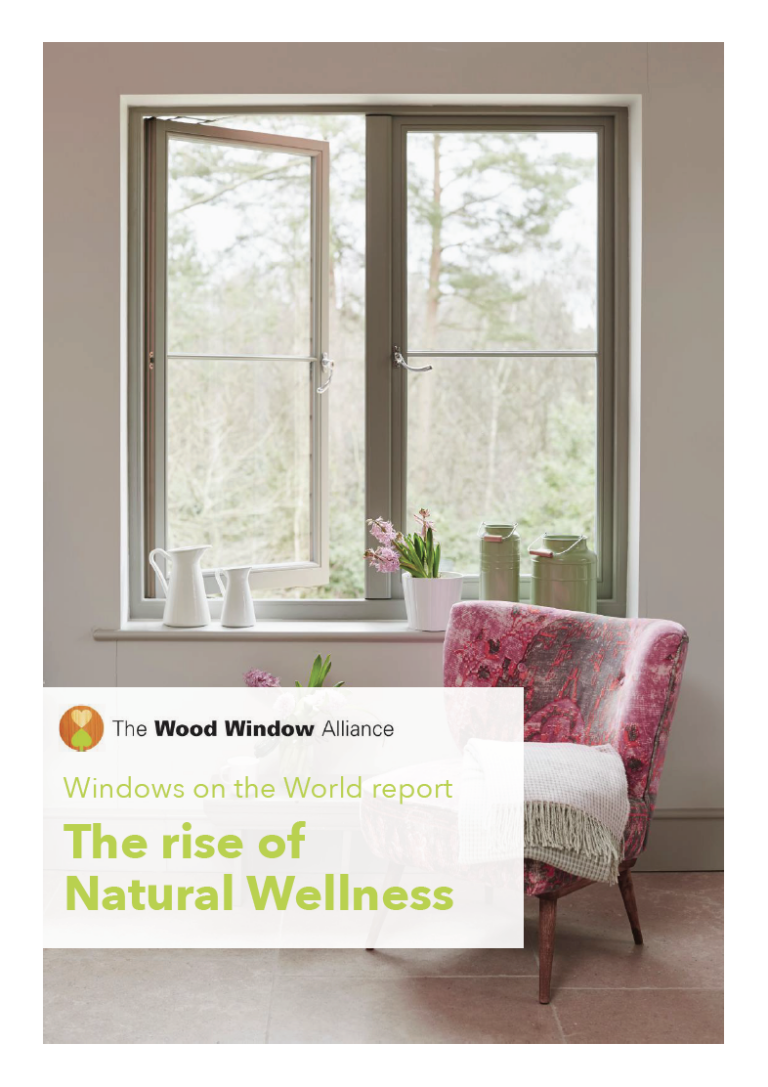 Bright sitting room with sash windows and floral cushions