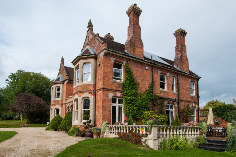 Red brick heritage building with chimneys