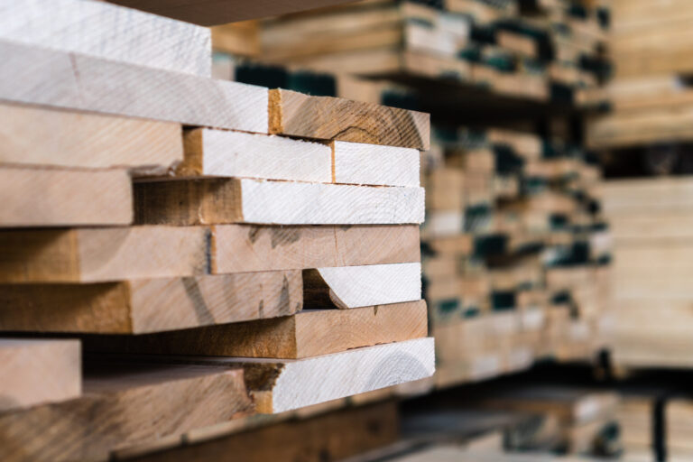 Stacked timber planks in a warehouse