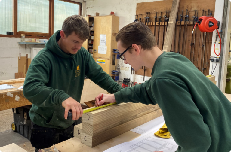 Two students working on joinery project