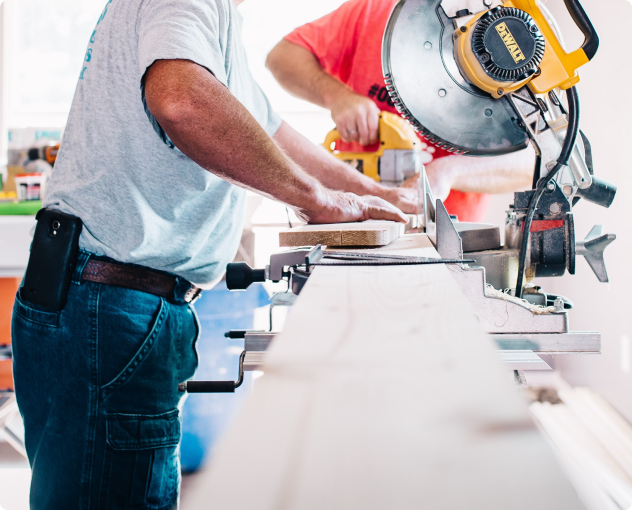 Man using power saw in workshop