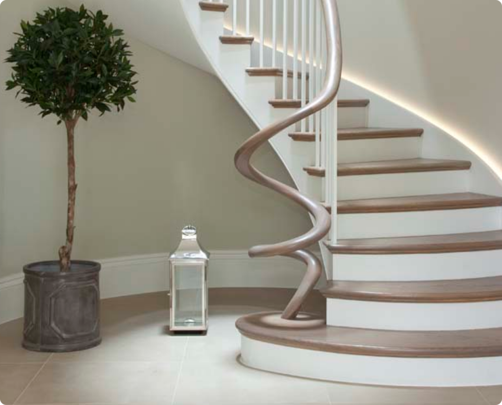 Curved wooden staircase with handrail