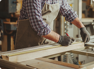 Joiner working on timber with clamp